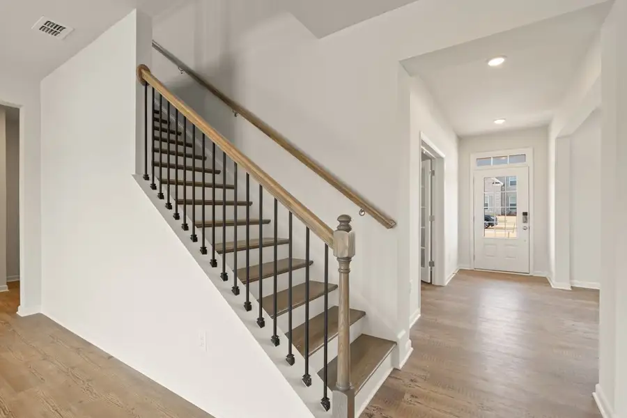 A staircase in a house. A staircase in a house.