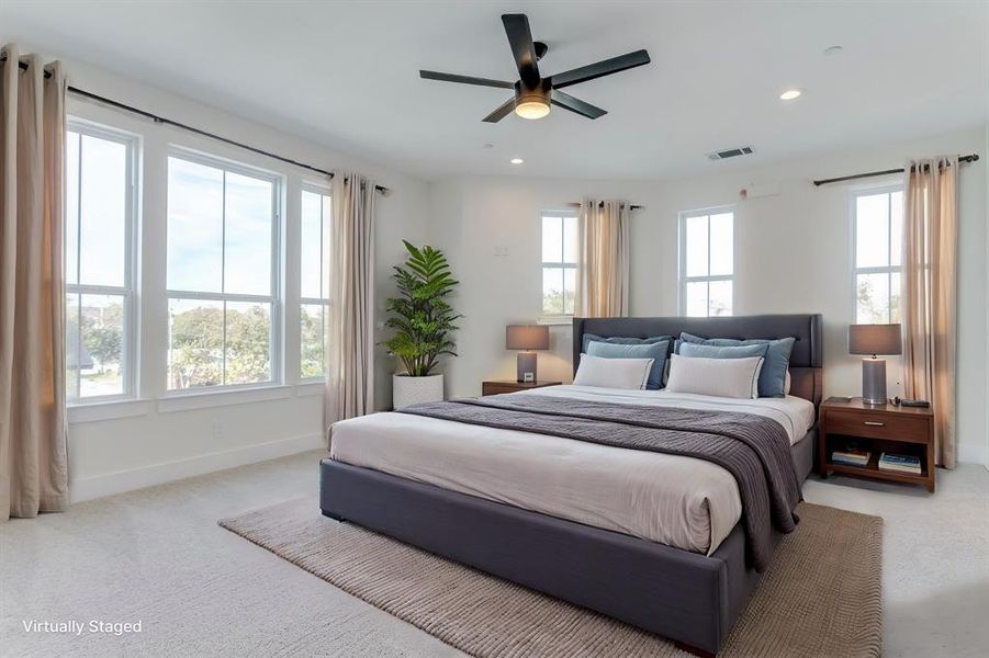 Carpeted bedroom featuring a ceiling fan, recessed lighting, visible vents, and baseboards