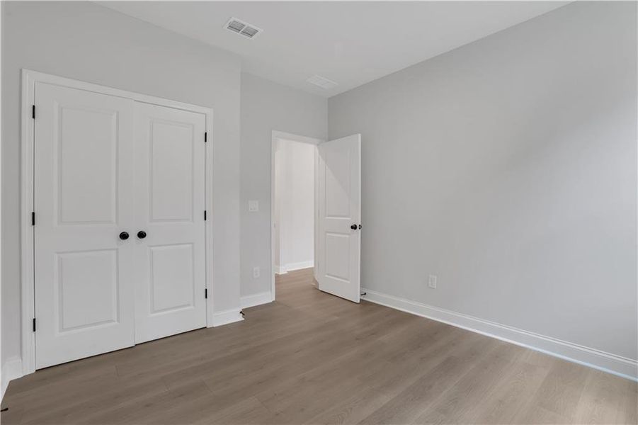 Spacious, unfurnished interior of a new home in The Paddocks at Doc Hughes, Buford (Image 44).