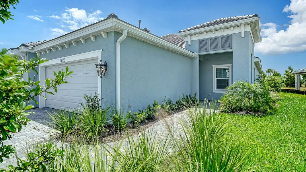 Exterior details and patio area of a home in Palm Grove Real Estate and Homes for Sale in Lakewood Ranch, FL - Neal Communities, Lakewood Ranch (Image 1). Exterior details and patio area of a home in Palm Grove Real Estate and Homes for Sale in Lakewood Ranch, FL - Neal Communities, Lakewood Ranch (Image 1).