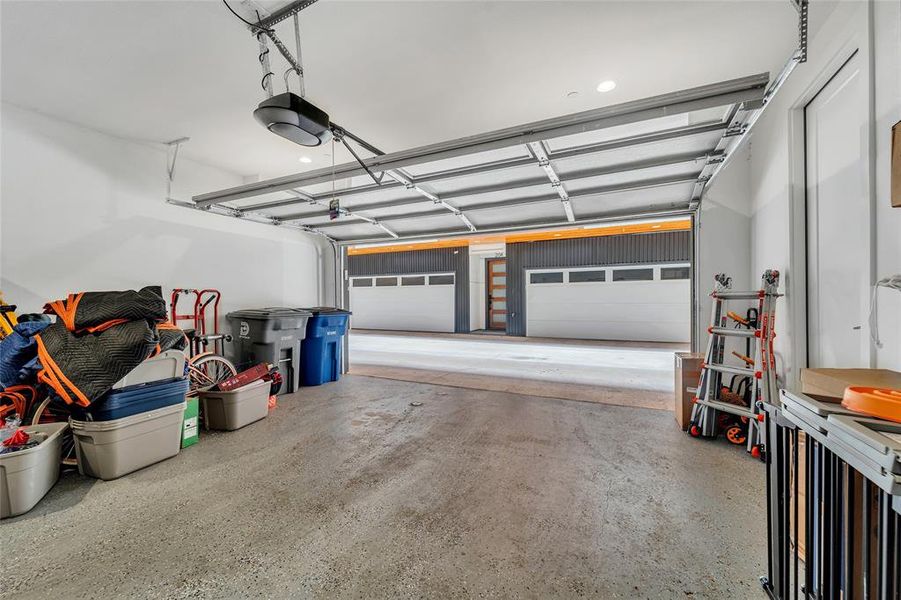 Garage featuring a garage door opener and recessed lighting Garage featuring a garage door opener and recessed lighting