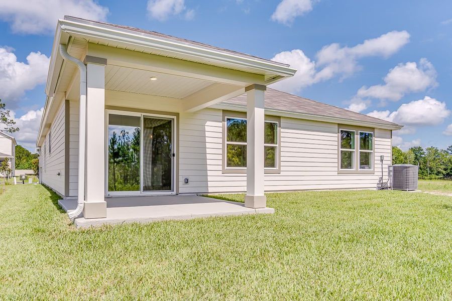 Front exterior of a new home in Copper Ridge, Jacksonville, FL, highlighting curb appeal (Image 2).