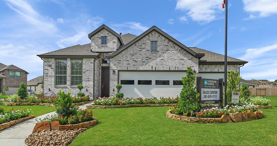 Front exterior of a new home in The Trails, New Caney, TX, highlighting curb appeal (Image 14). Front exterior of a new home in The Trails, New Caney, TX, highlighting curb appeal (Image 14).