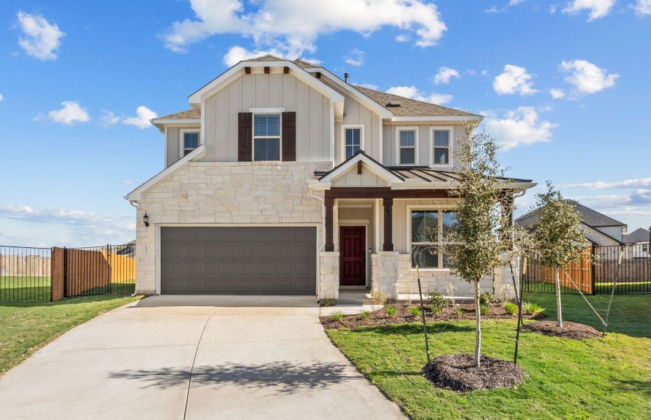 Front exterior of a new home in Santa Rita Ranch, Liberty Hill, TX, highlighting curb appeal (Image 22).