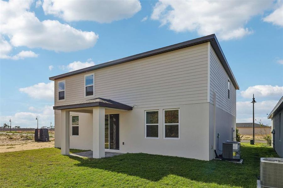 Exterior details and patio area of a home in Crosswinds - Signature Series, Haines City (Image 3).