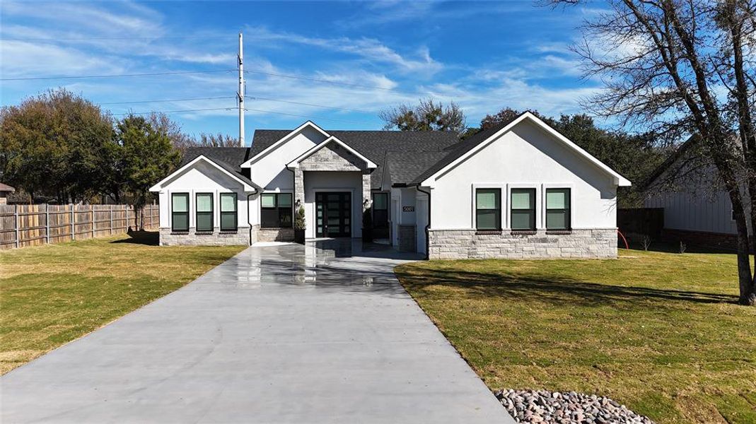 View of front of house featuring a front lawn