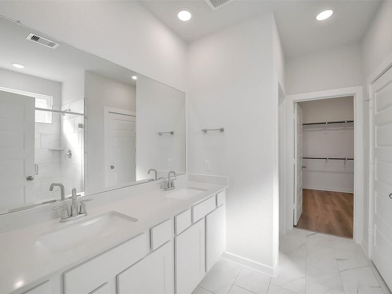 Furnished interior view inside a new home in Sunterra, Katy (Image 7).