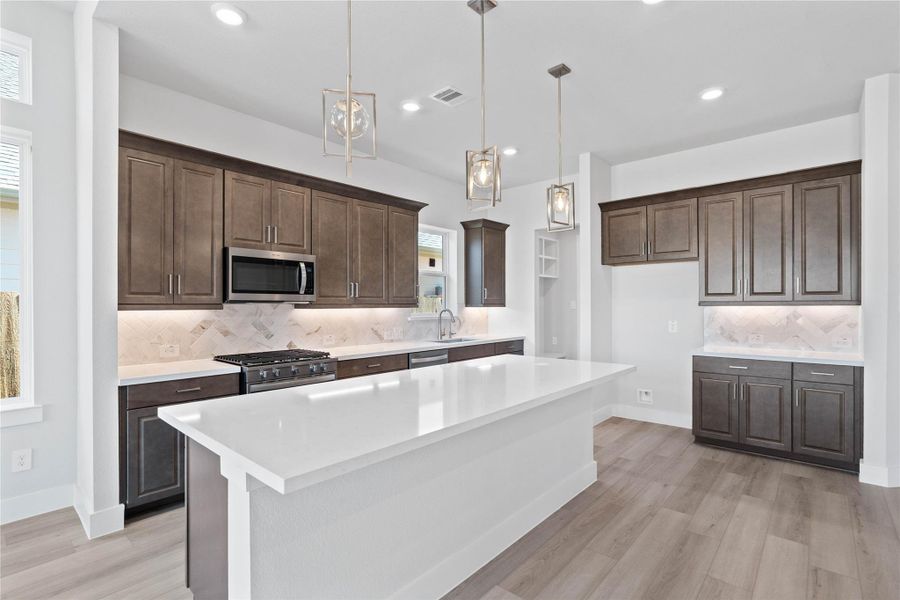 The kitchen is more than just a place to cook; it's a central gathering space designed for creating memories, entertaining guests, and daily living.