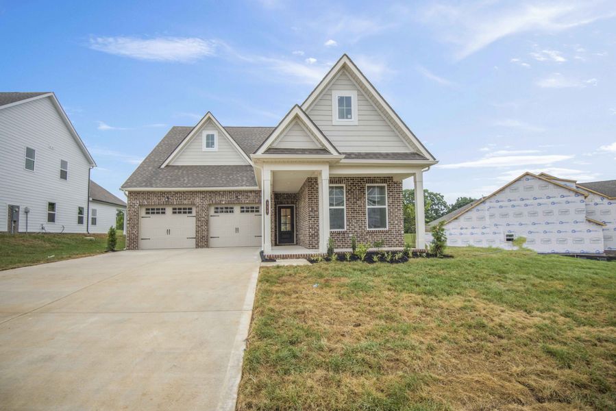 French Country Elevation *Photo of example home. Selections and Finishes May Vary.*