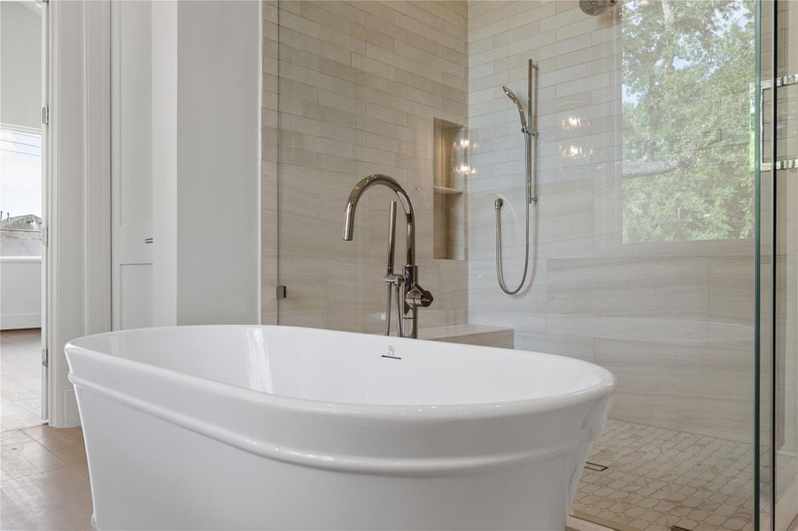 Soaking tub outside the shower.