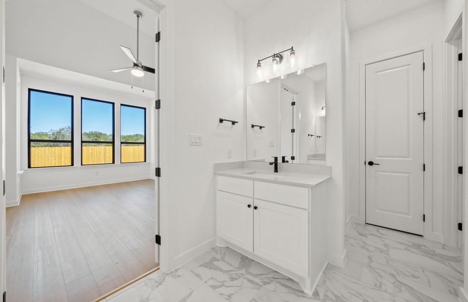 Furnished interior view inside a new home in 6 Creeks, Kyle (Image 5).