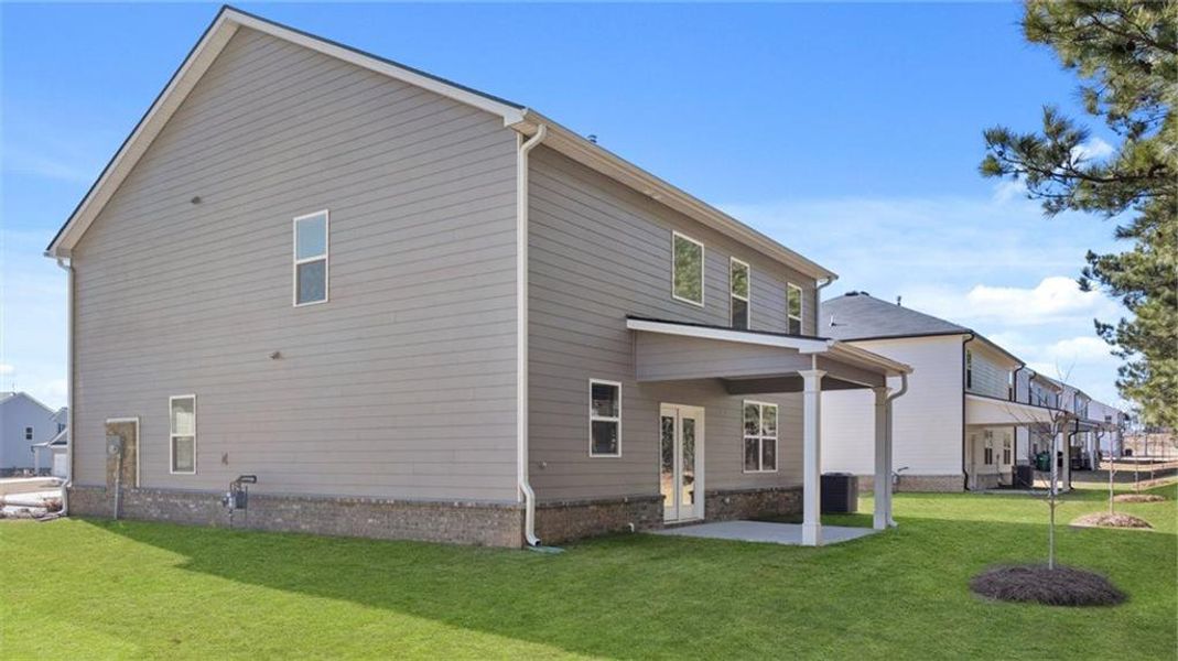 Exterior details and patio area of a home in Bridle Creek, Locust Grove (Image 4).