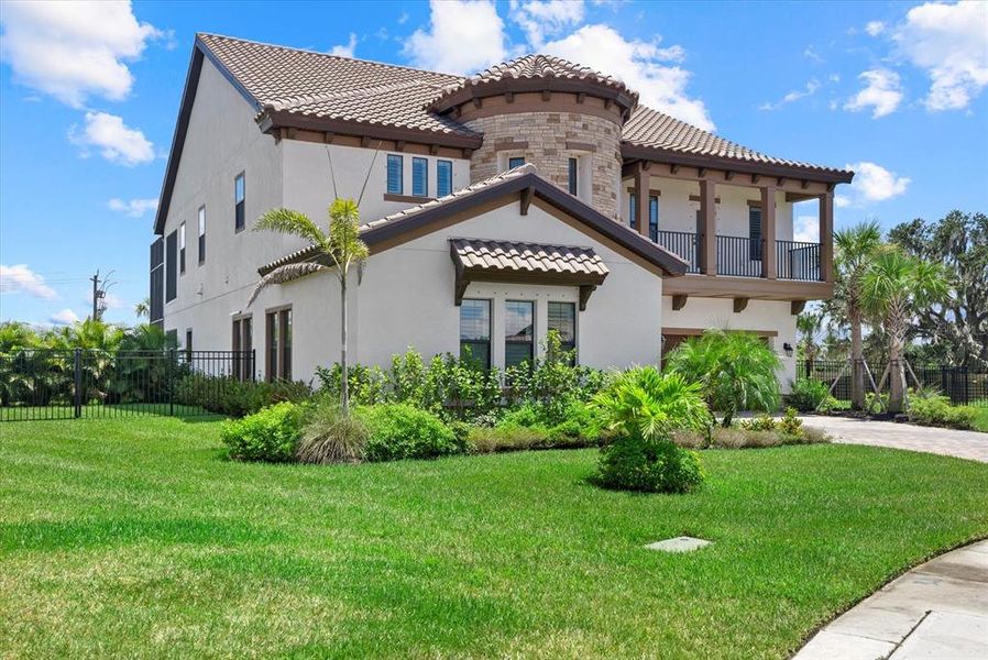 Front exterior of a new home in Crosswind Ranch, Parrish, FL, highlighting curb appeal (Image 23).