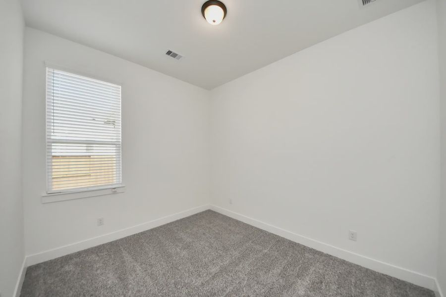 Representative unfurnished interior of a home built from the Bonneville by Chesmar Homes in Meridiana 50's and 60's, Manvel (Image 33).