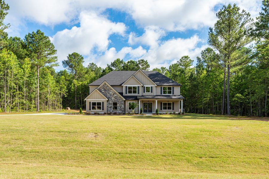 Front exterior of a new home in Flint Farms, Concord, GA, highlighting curb appeal (Image 1).