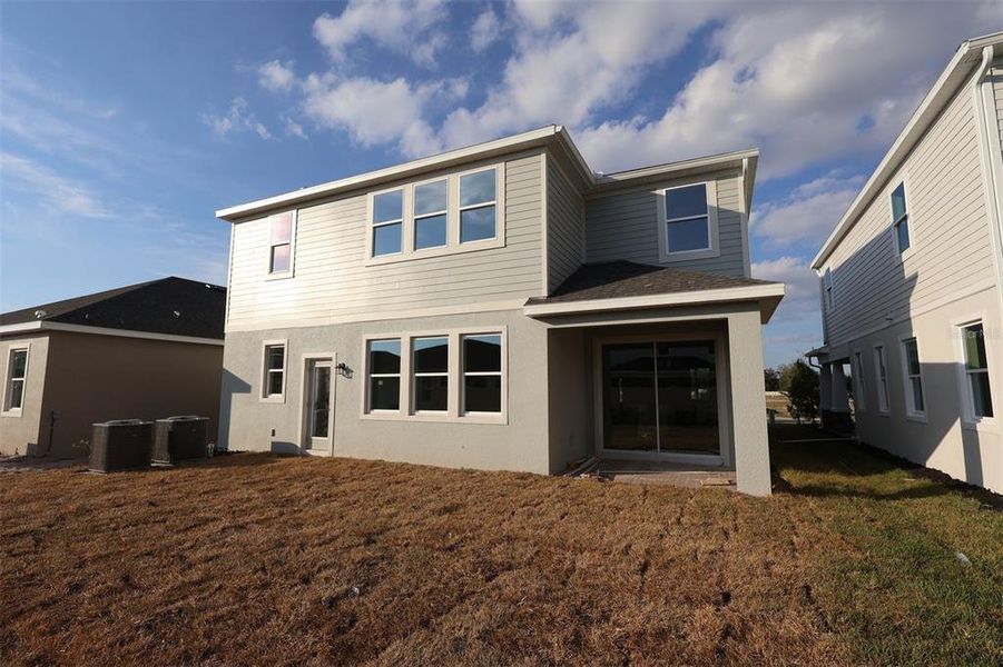 Exterior details and patio area of a home in Center Lake on the Park, St. Cloud (Image 3).