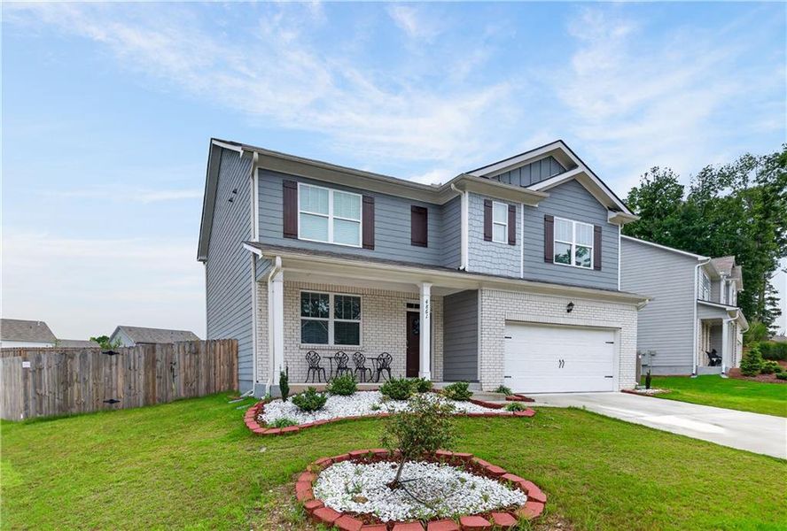 Front exterior of a new home in Glen at Kensington, Lithia Springs, GA, highlighting curb appeal (Image 20).