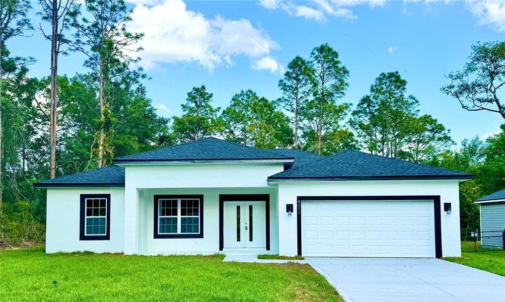 Front exterior of a new home in , Citrus Springs, FL, highlighting curb appeal (Image 1).