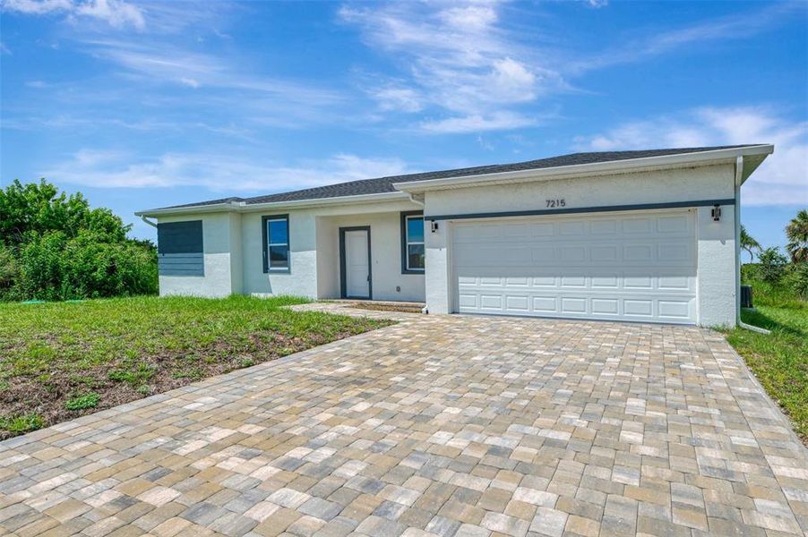 Front exterior of a new home in , Port Charlotte, FL, highlighting curb appeal (Image 17). Front exterior of a new home in , Port Charlotte, FL, highlighting curb appeal (Image 17).
