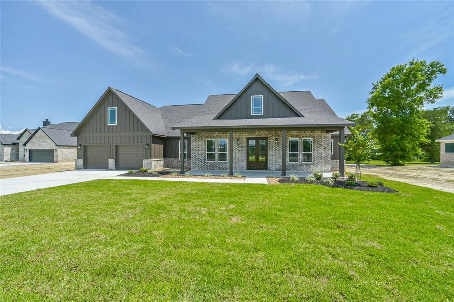 Front exterior of a new home in , Baytown, TX, highlighting curb appeal (Image 25).