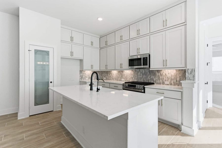 Furnished interior view inside a new home in Centero at Stone Oak, San Antonio (Image 5).