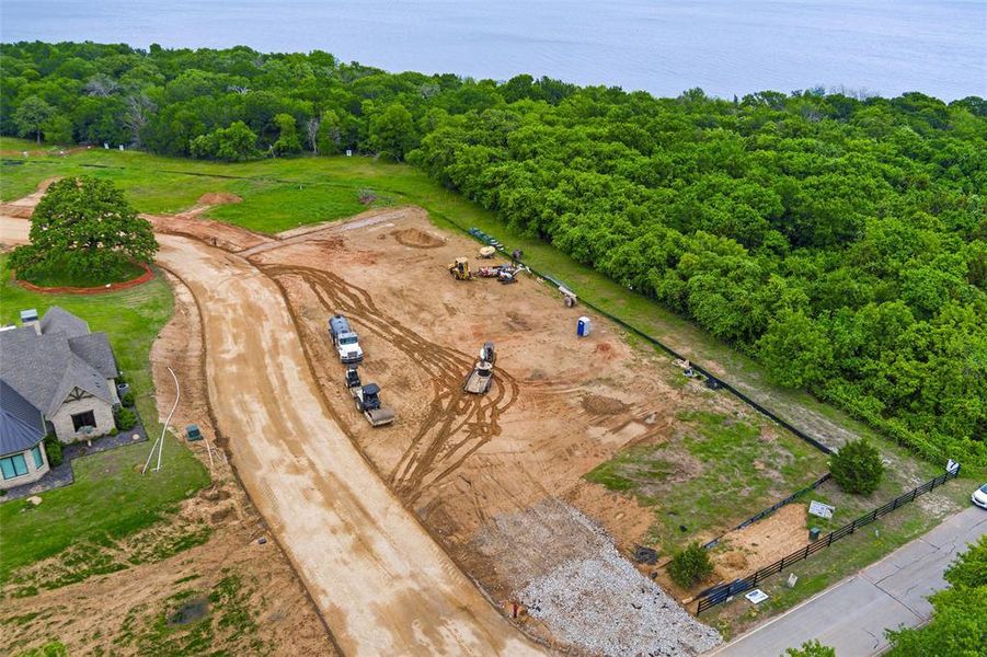 Large undeveloped parcel with established perimeter fencing, mature tree lines, and a partially graveled roadway Large undeveloped parcel with established perimeter fencing, mature tree lines, and a partially graveled roadway