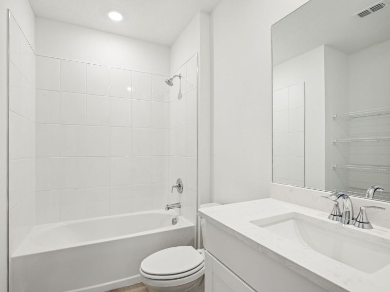 Furnished interior view inside a new home in The Grove at Stuart Crossing - Premier Series, Bartow (Image 7).