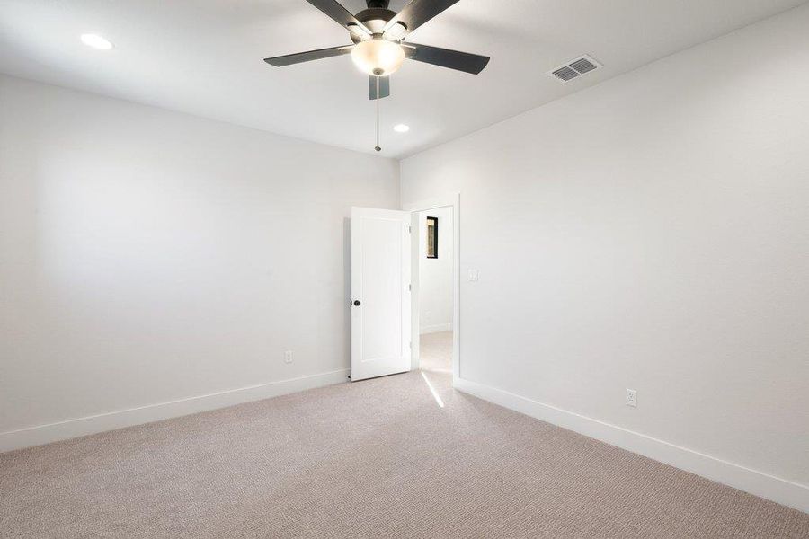 Carpeted spare room with recessed lighting and a ceiling fan