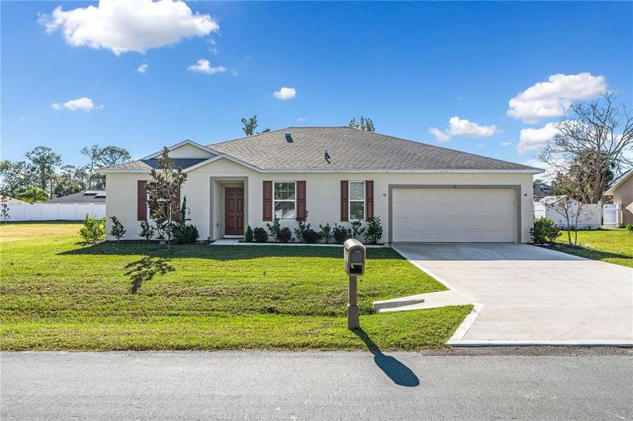 Front exterior of a new home in Palm Coast, Palm Coast, FL, highlighting curb appeal (Image 1). Front exterior of a new home in Palm Coast, Palm Coast, FL, highlighting curb appeal (Image 1).