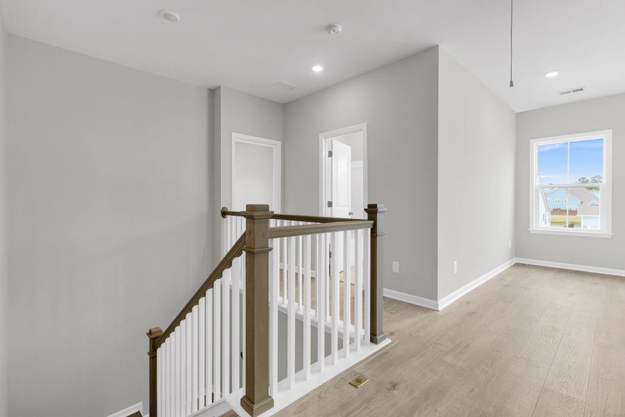 Spacious, unfurnished interior of a new home in Tidewater at Lakes of Cane Bay, Summerville (Image 27). Spacious, unfurnished interior of a new home in Tidewater at Lakes of Cane Bay, Summerville (Image 27).