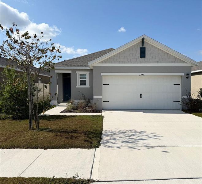 Front exterior of a new home in Villamar, Winter Haven, FL, highlighting curb appeal (Image 1). Front exterior of a new home in Villamar, Winter Haven, FL, highlighting curb appeal (Image 1).