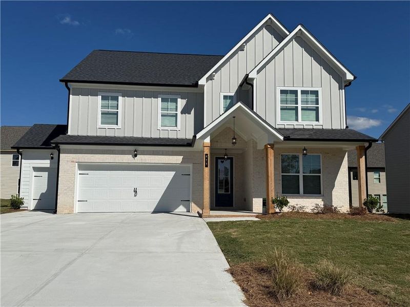 Front exterior of a home in the The Fairways at Mirror Lake community, located in Villa Rica, GA (Image 2).