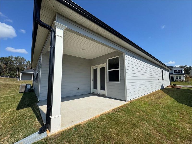 Exterior details and patio area of a home in Oakchase at Hampton, Hampton (Image 1).