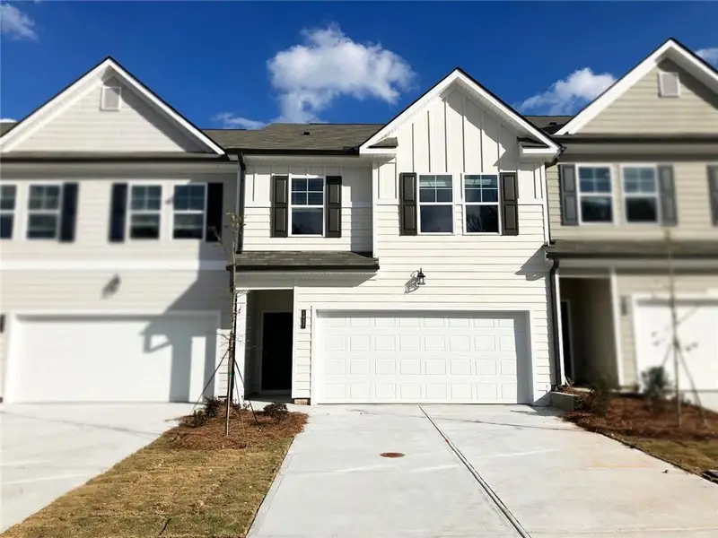 Front exterior of a new home in Rivershire Place, Villa Rica, GA, highlighting curb appeal (Image 1). Front exterior of a new home in Rivershire Place, Villa Rica, GA, highlighting curb appeal (Image 1).