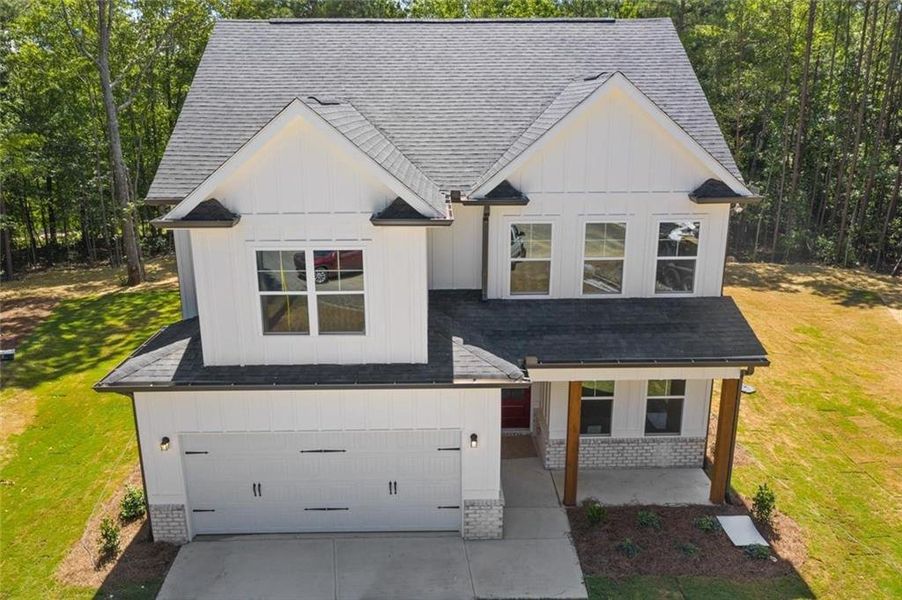 Front exterior of a new home in , Dallas, GA, highlighting curb appeal (Image 6).