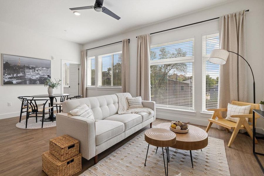 Living room featuring wood finished floors, a ceiling fan, and recessed lighting