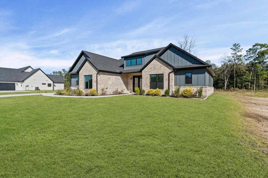 Front exterior of a new home in , Conroe, TX, highlighting curb appeal (Image 27).