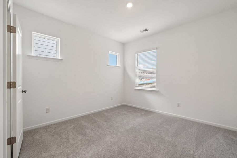 Spacious, unfurnished interior of a new home in Terraces at the Exchange, Indian Land (Image 30).
