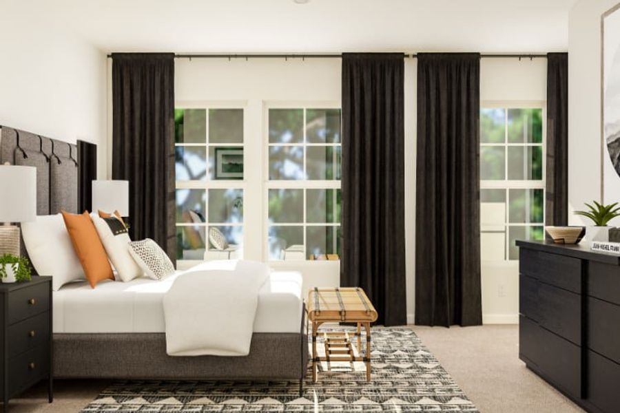 A room with a couch and a table with a window.