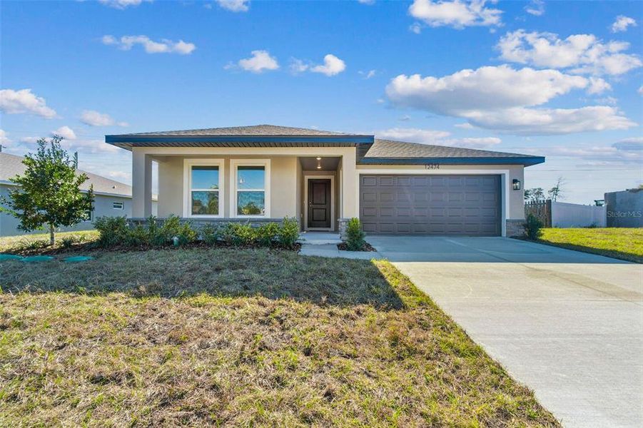 Front exterior of a new home in , Spring Hill, FL, highlighting curb appeal (Image 31).