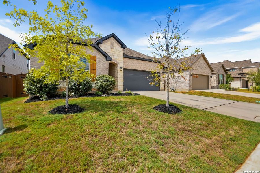 Front exterior of a new home in Corley Farms, Boerne, TX, highlighting curb appeal (Image 27). Front exterior of a new home in Corley Farms, Boerne, TX, highlighting curb appeal (Image 27).