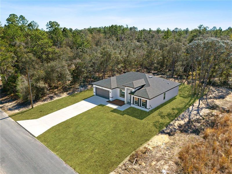 Front exterior of a new home in , Citrus Springs, FL, highlighting curb appeal (Image 22).