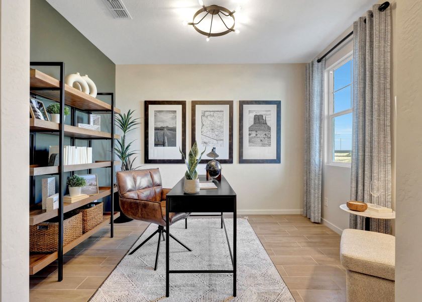 A room with a table and chairs.