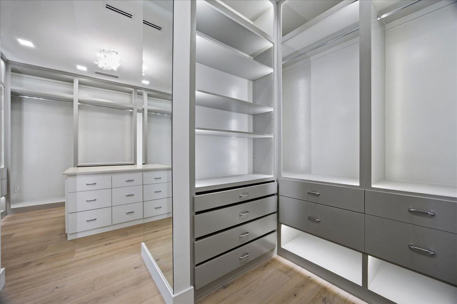 Integrated lighting and thoughtfully designed shelving elevate everyday organization into a luxury experience.