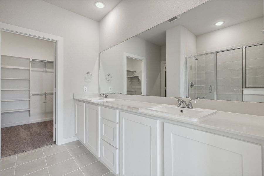 Primary Bathroom in the Mesquite home plan by Trophy Signature Homes – REPRESENTATIVE PHOTO