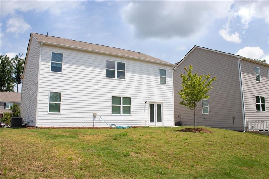 Front exterior of a new home in Braselton Village, Braselton, GA, highlighting curb appeal (Image 1). Front exterior of a new home in Braselton Village, Braselton, GA, highlighting curb appeal (Image 1).