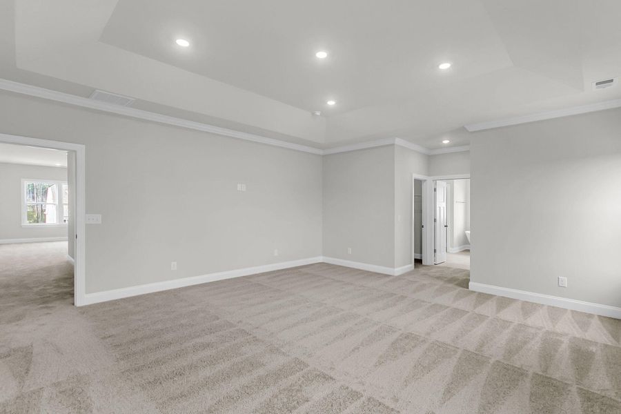 Spacious, unfurnished interior of a new home in Tidewater at Lakes of Cane Bay, Summerville (Image 19).