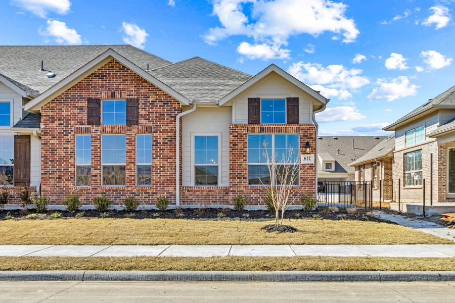 Front exterior of a new home in Woodbridge Villas, Wylie, TX, highlighting curb appeal (Image 1). Front exterior of a new home in Woodbridge Villas, Wylie, TX, highlighting curb appeal (Image 1).