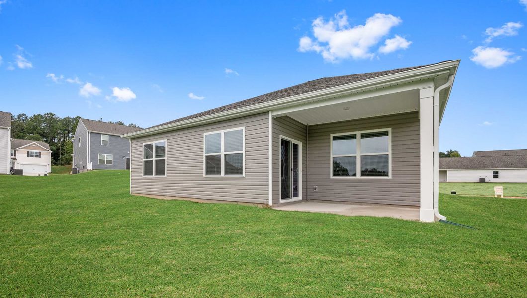 Exterior details and patio area of a home in Durbin Meadows Traditions, Fountain Inn (Image 3).