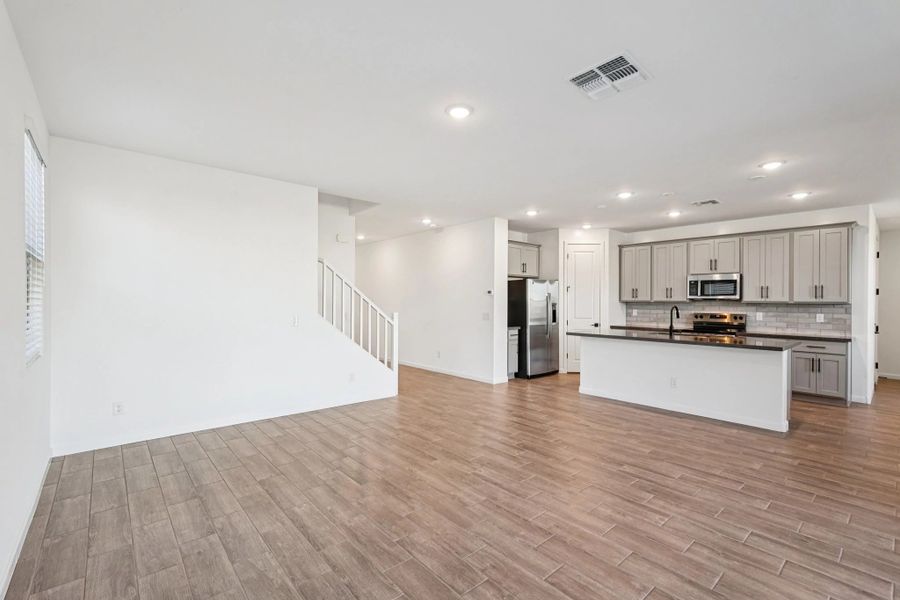Great room and kitchen. Not actual home, finishes and options may vary.
